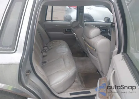 1990 Lincoln Town Car Signature z USA, uszkodzony, nr VIN 1LNLM82F2LY744198